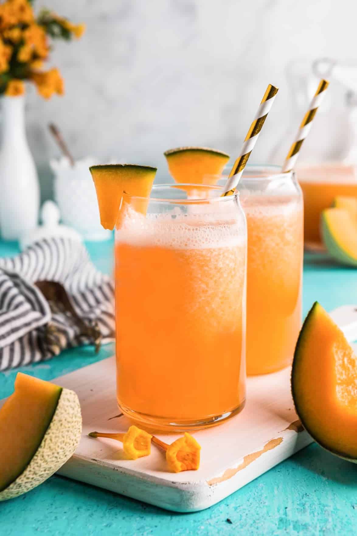 Cantaloupe agua fresca in glasses with fresh melon garnish.