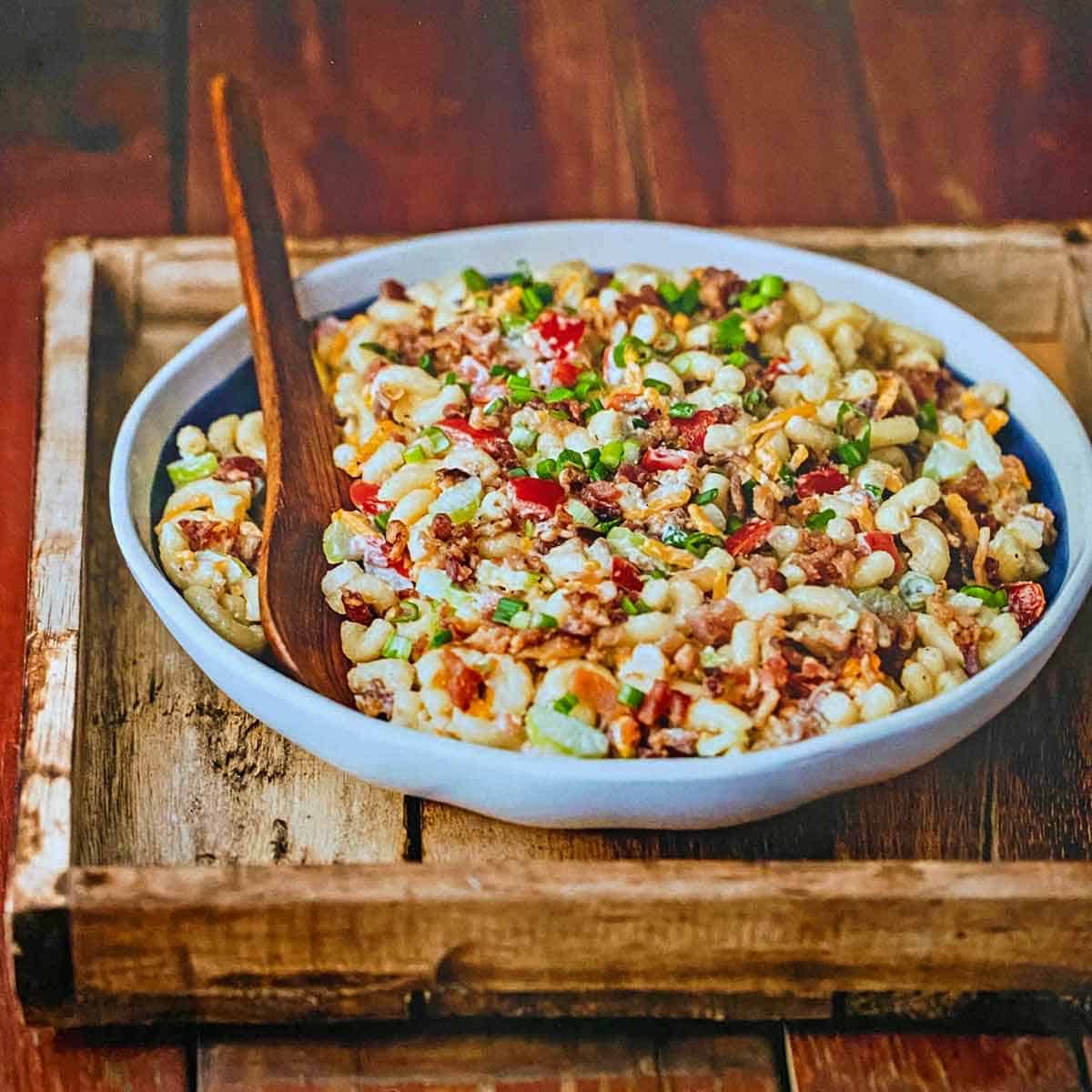 Creamy bacon macaroni salad with cheese, peppers, and green onions.