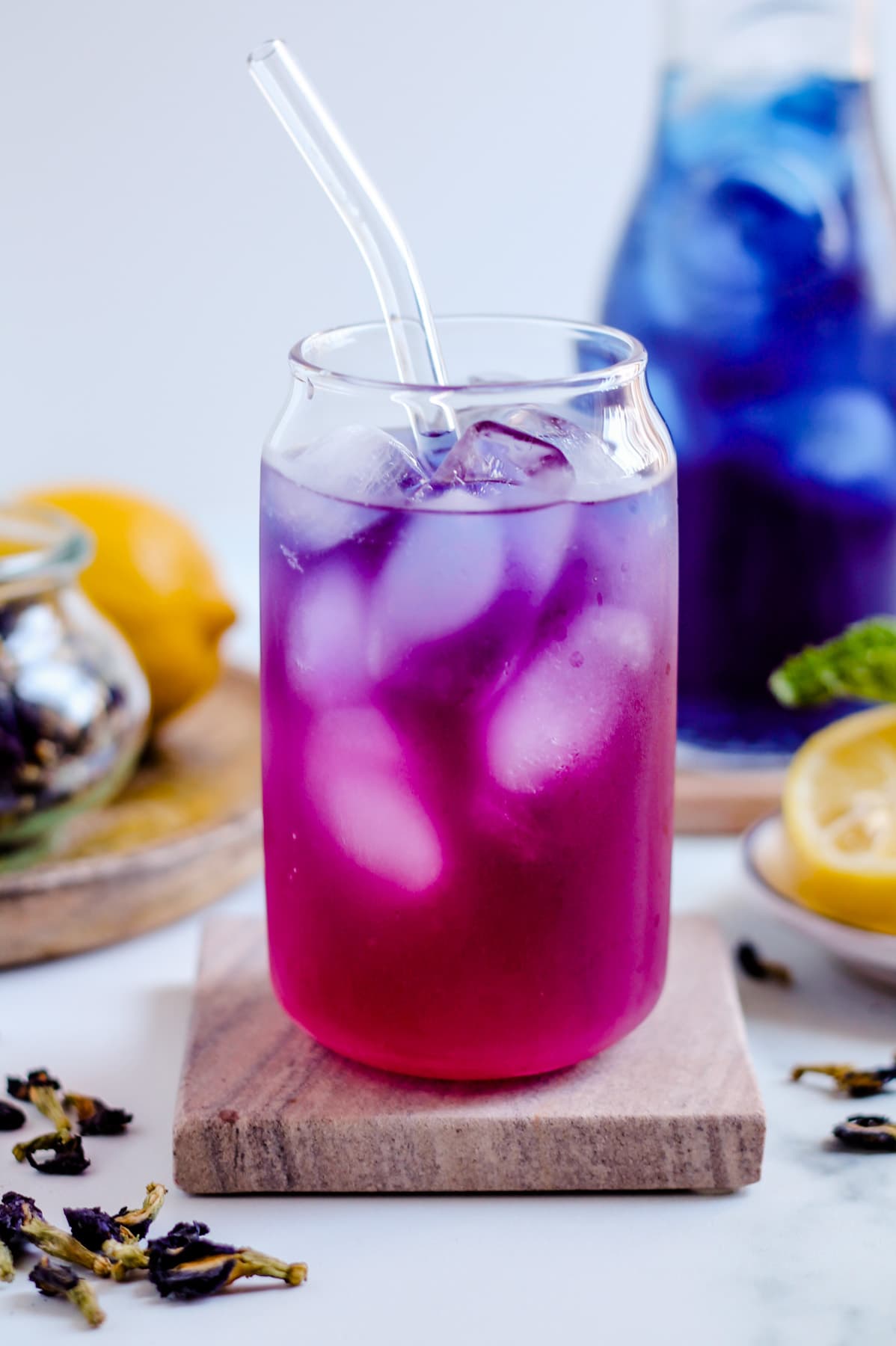 Color-changing butterfly pea tea lemonade over ice.