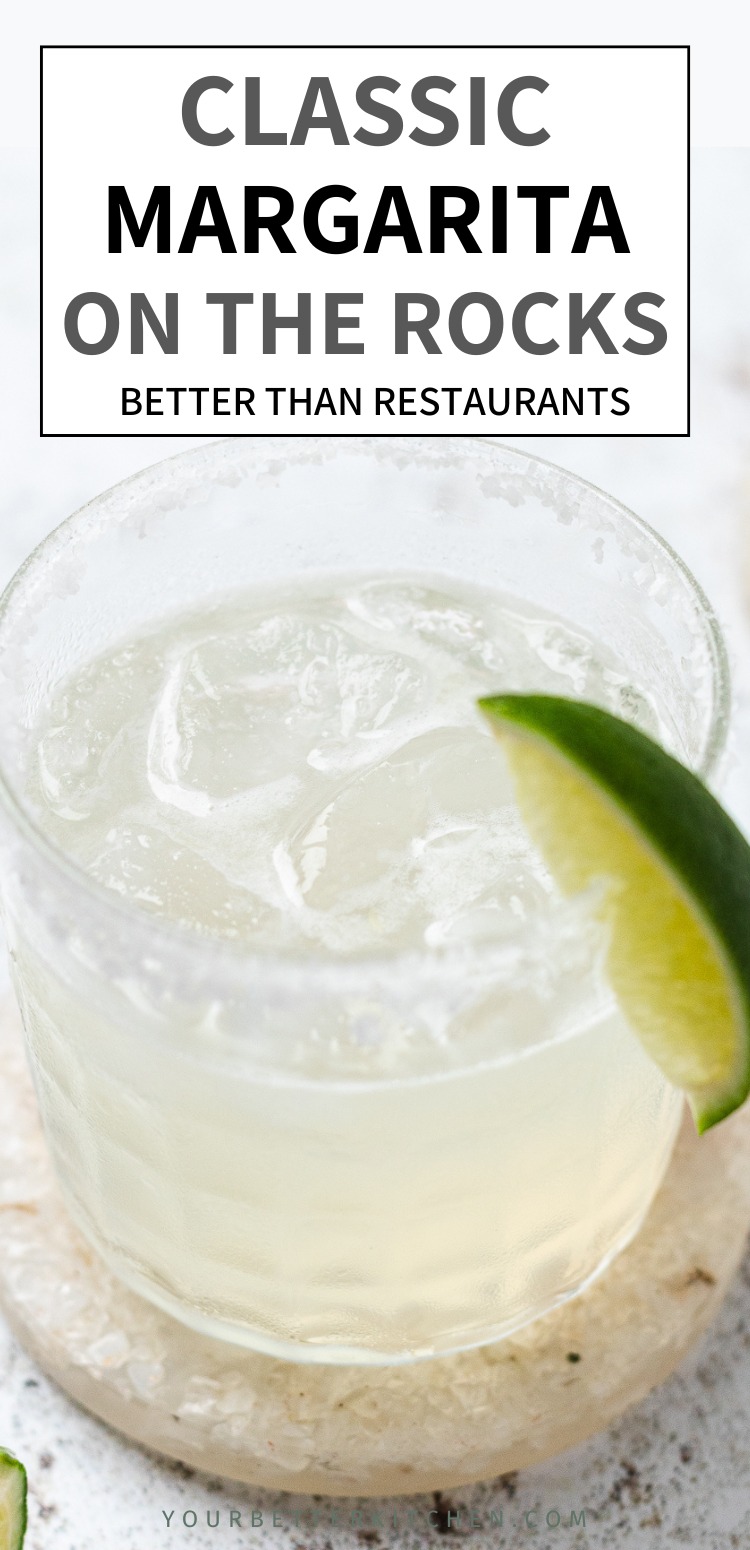 Pinterest pin image of a classic margarita on the rocks with a lime wedge and salt rim, with text that reads “Classic Margarita On The Rocks Better Than Restaurants”.