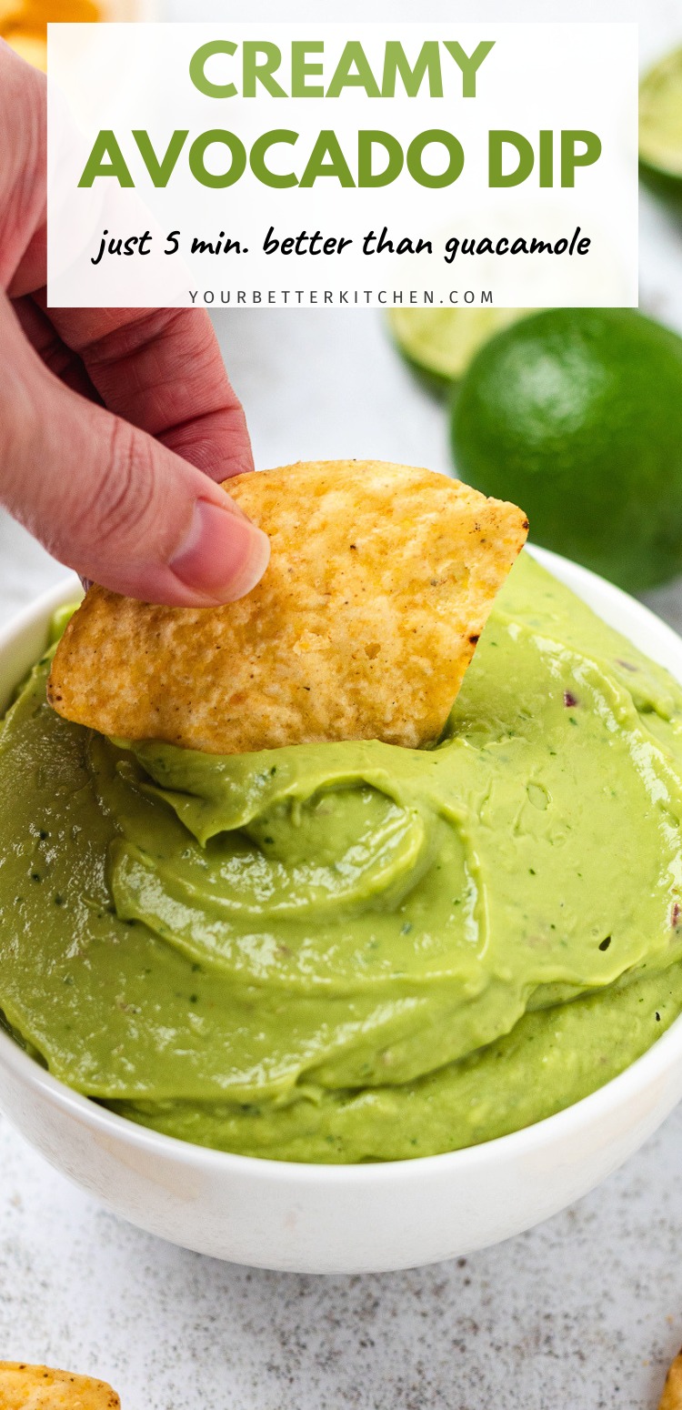 Bowl of creamy green avocado dip with a chip being dipped with text says Creamy Avocado Dip, just 5 min better than guacamole.