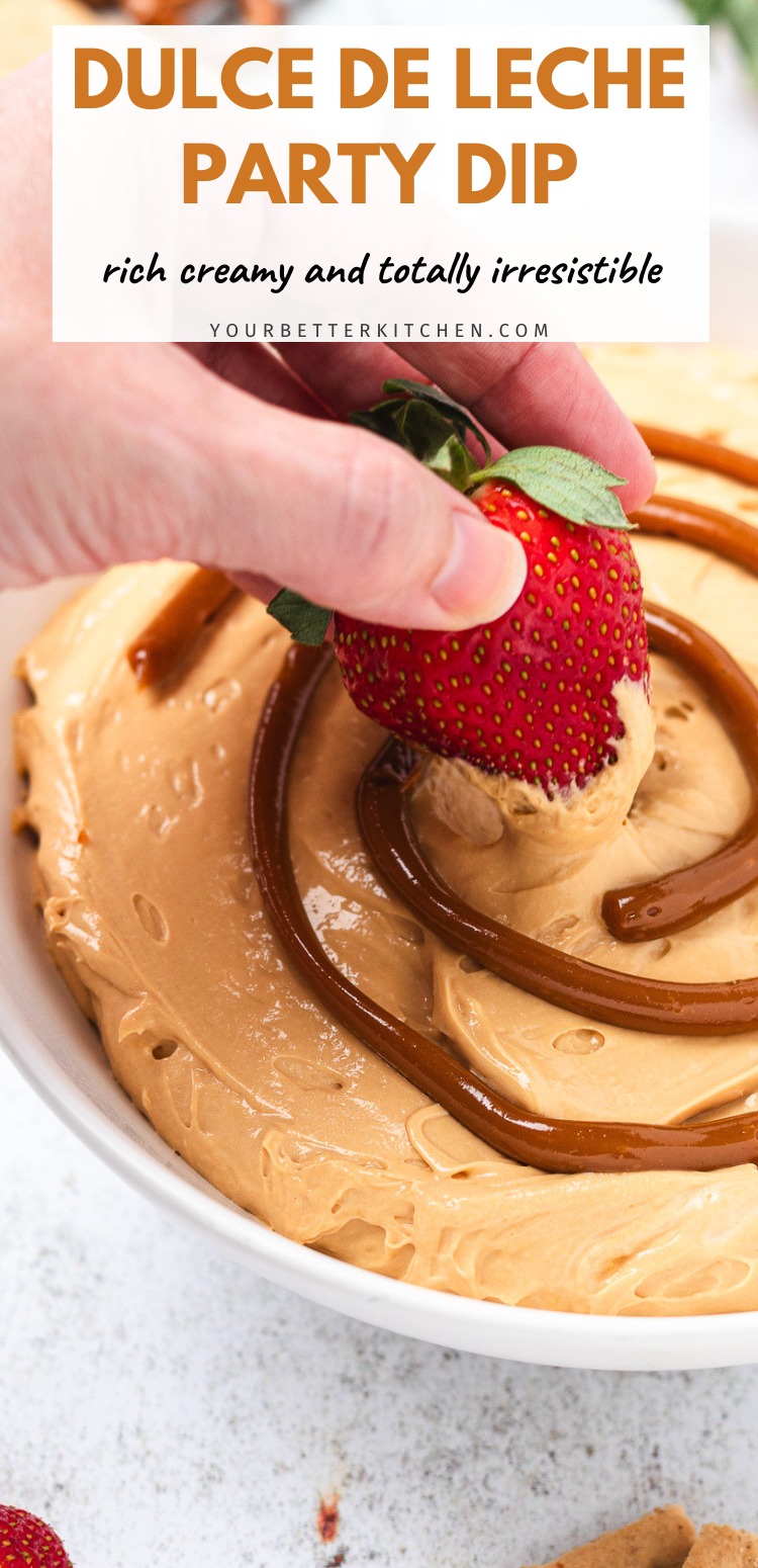 Bowl of dulce de leche dip with a strawberry being dipped. Text says Dulce de Leche Party Dip rich creamy and totally irresistible.