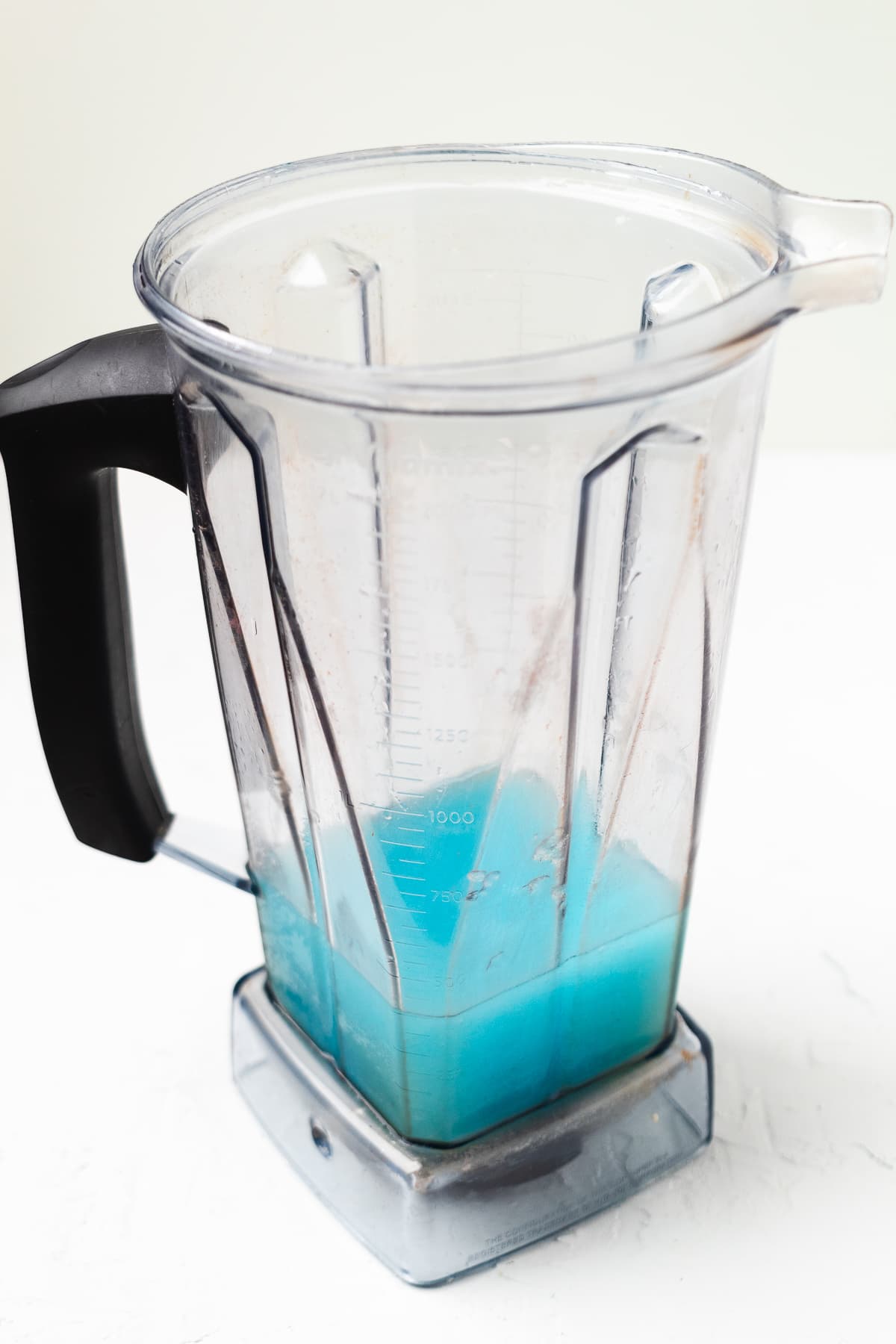 Pitcher full of frozen blue margarita blended.