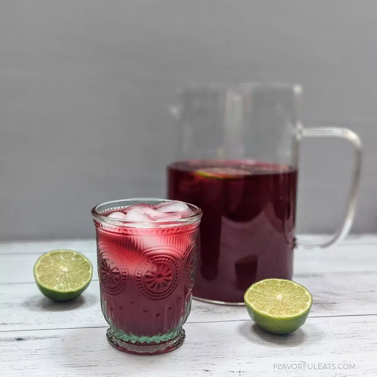 Hibiscus limeade served over ice with citrus.