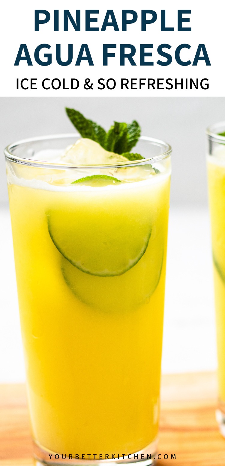 Tall glass of yellow drink with lime, ice, and mint. Text says Pineapple Agua Fresca Ice Cold and So Refreshing.
