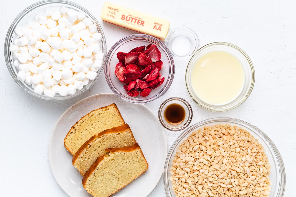 Ingredients for strawberry shortcake Rice Krispie treats arranged on a countertop.
