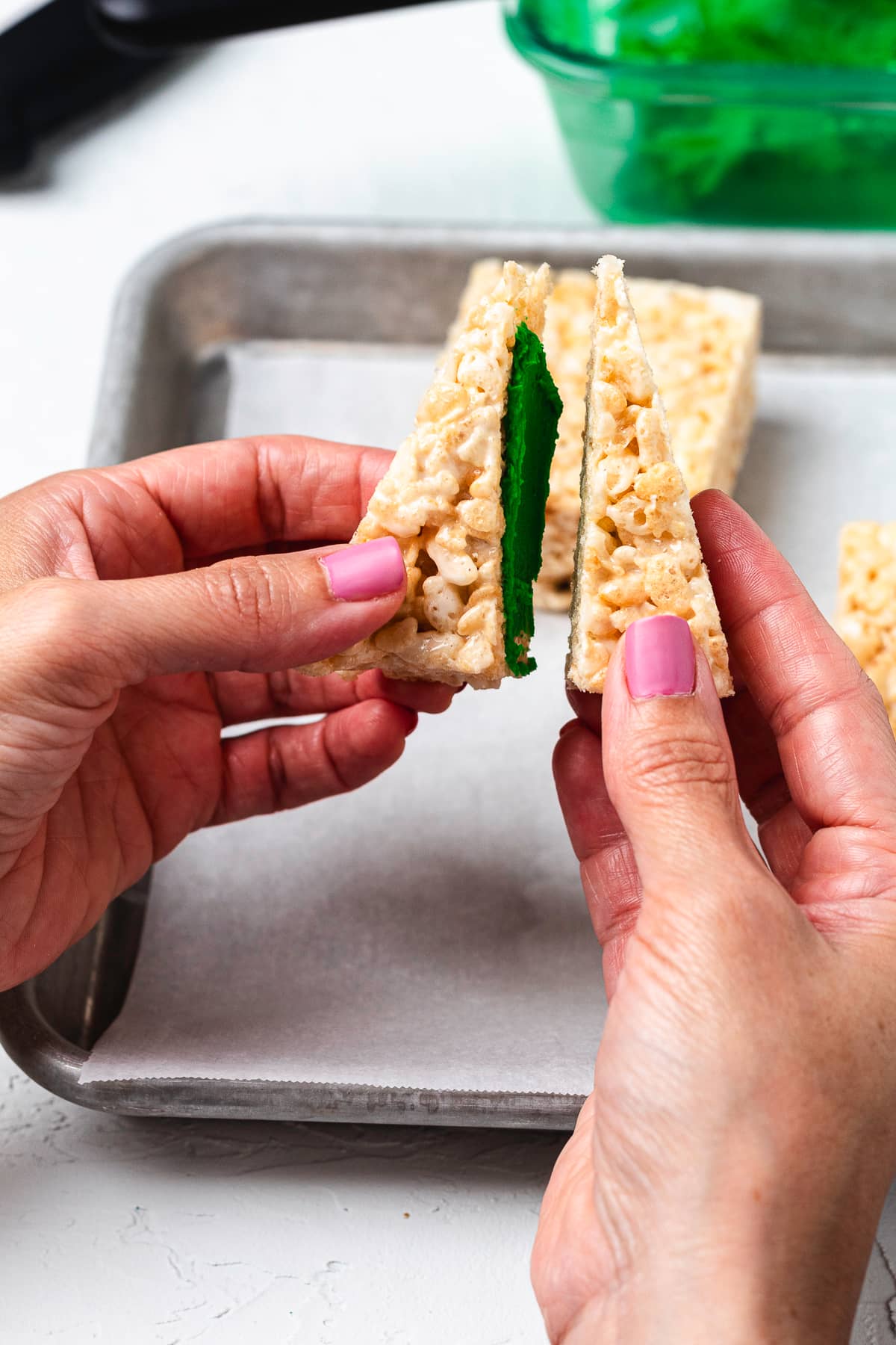Combining Rice Krispie treat triangles.