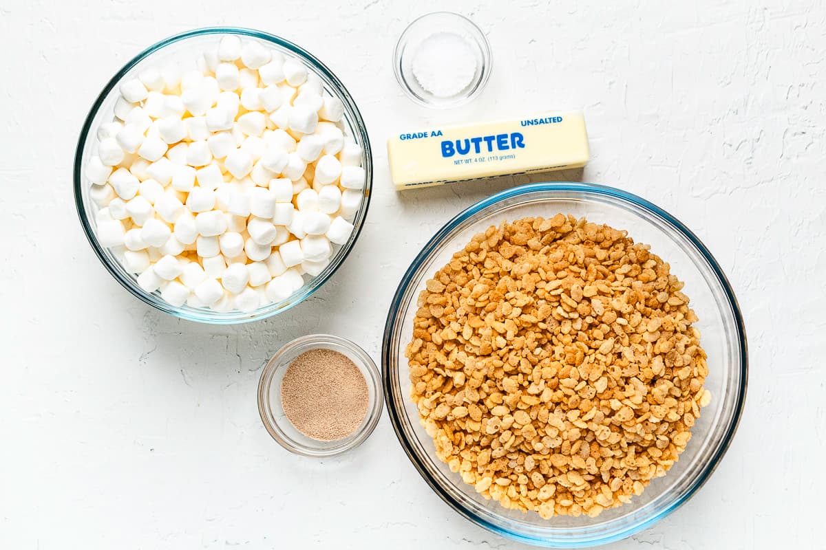 Ingredients for apple cider Rice Krispie treats, including cereal, marshmallows, butter, salt, and cider mix.