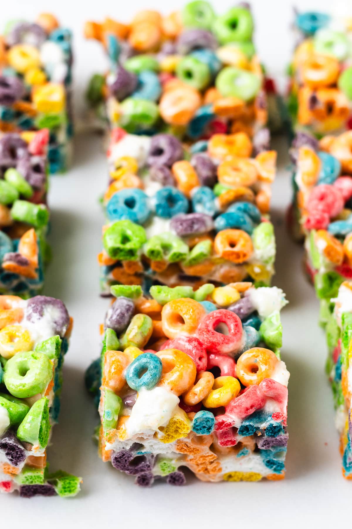 Froot Loops Rice Krispie Treats cut into squares.
