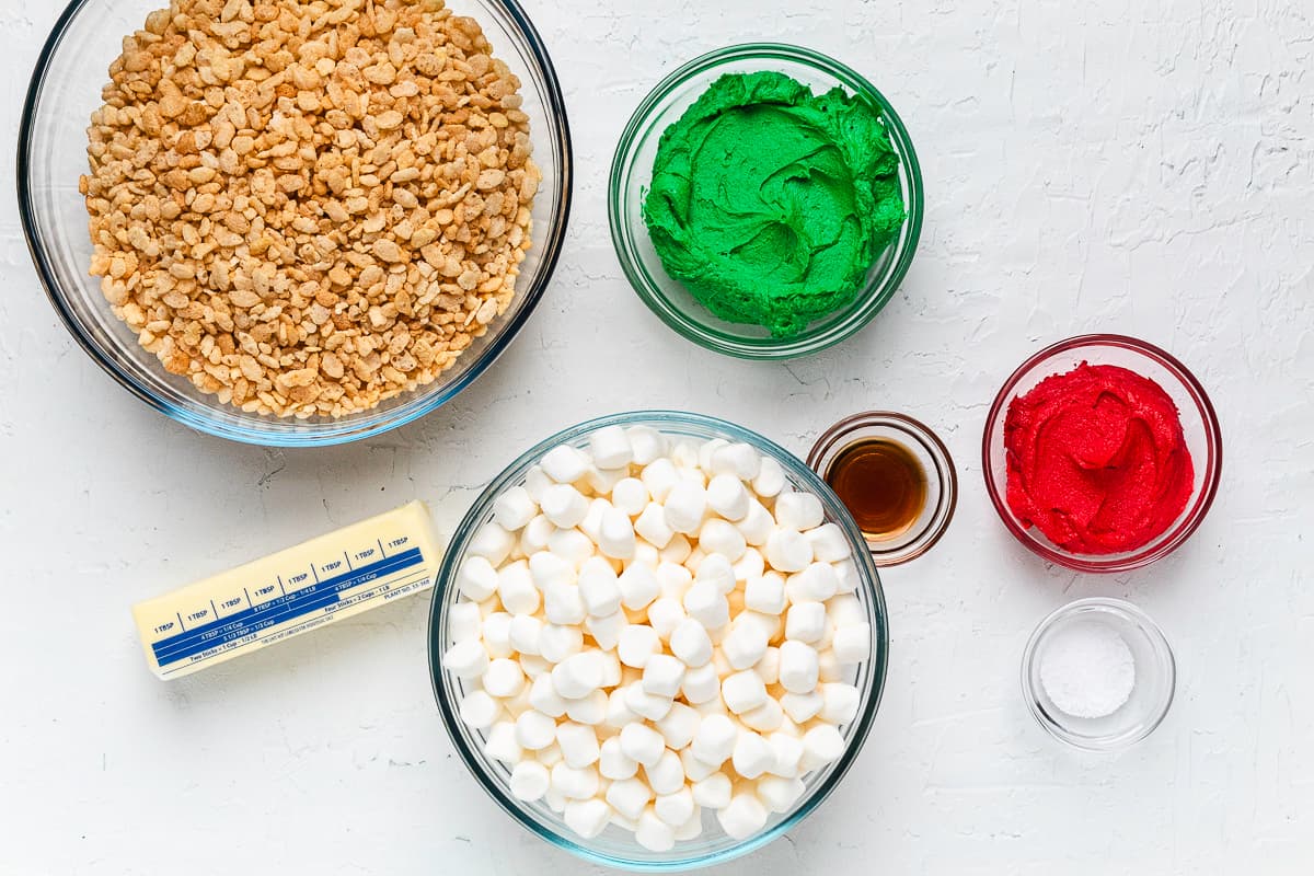 Ingredients for Grinch Rice Krispie treats arranged on a countertop.