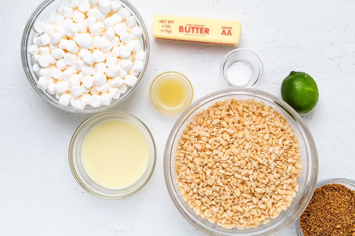 Ingredients for key lime Rice Krispie treats arranged on a white surface.