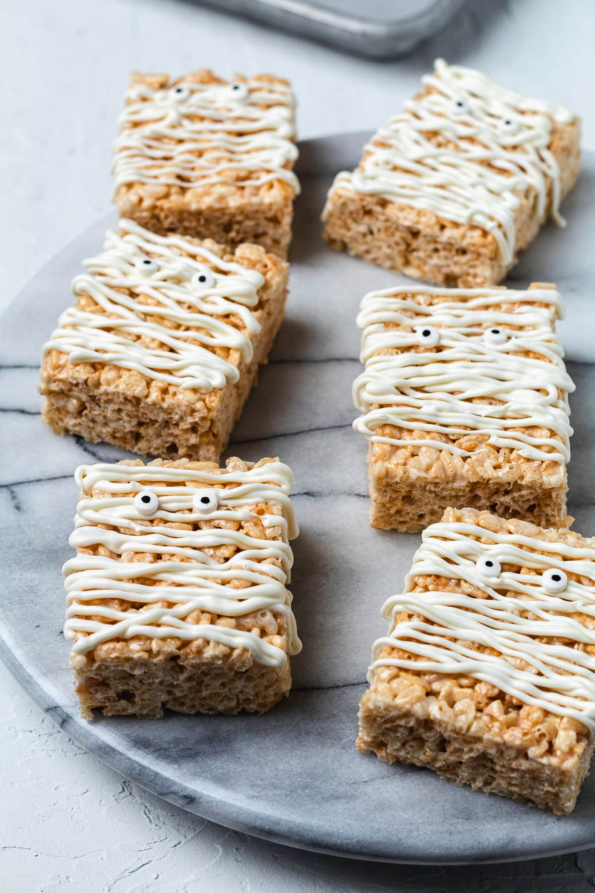 Mummy Rice Krispie treats on marble board
