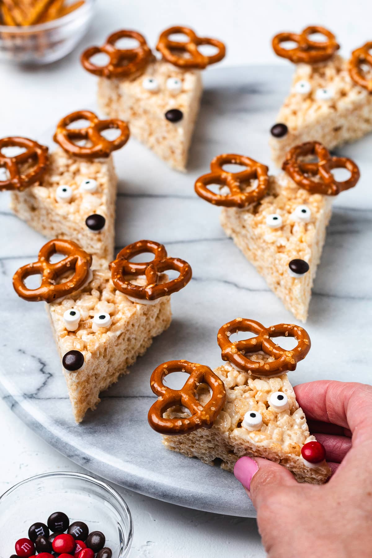 Reindeer Rice Krispie treats on a marble serving board.