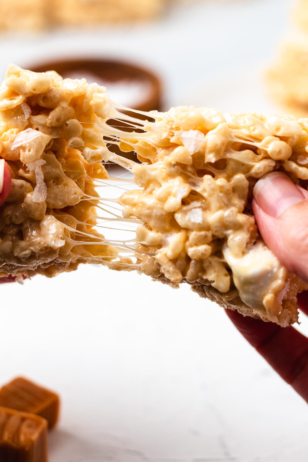 Gooey salted caramel Rice Krispie treat pulled apart.