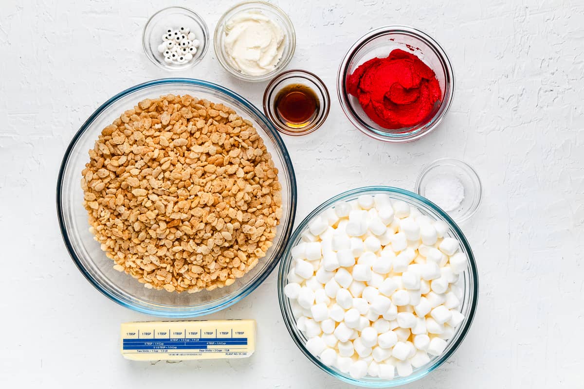Ingredients for Santa hat Rice Krispie treats in glass bowls.