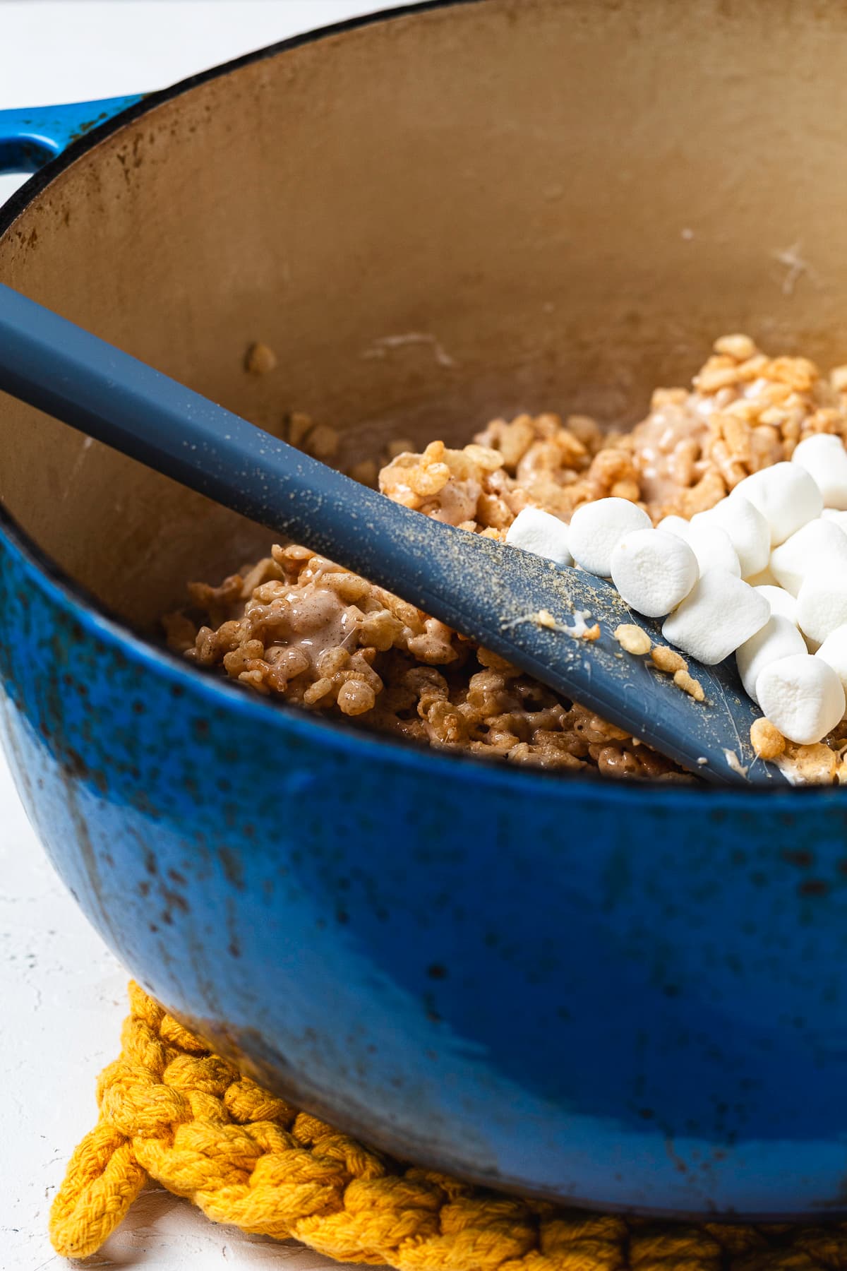 Mini marshmallows being added to the chai Rice Krispie mixture.