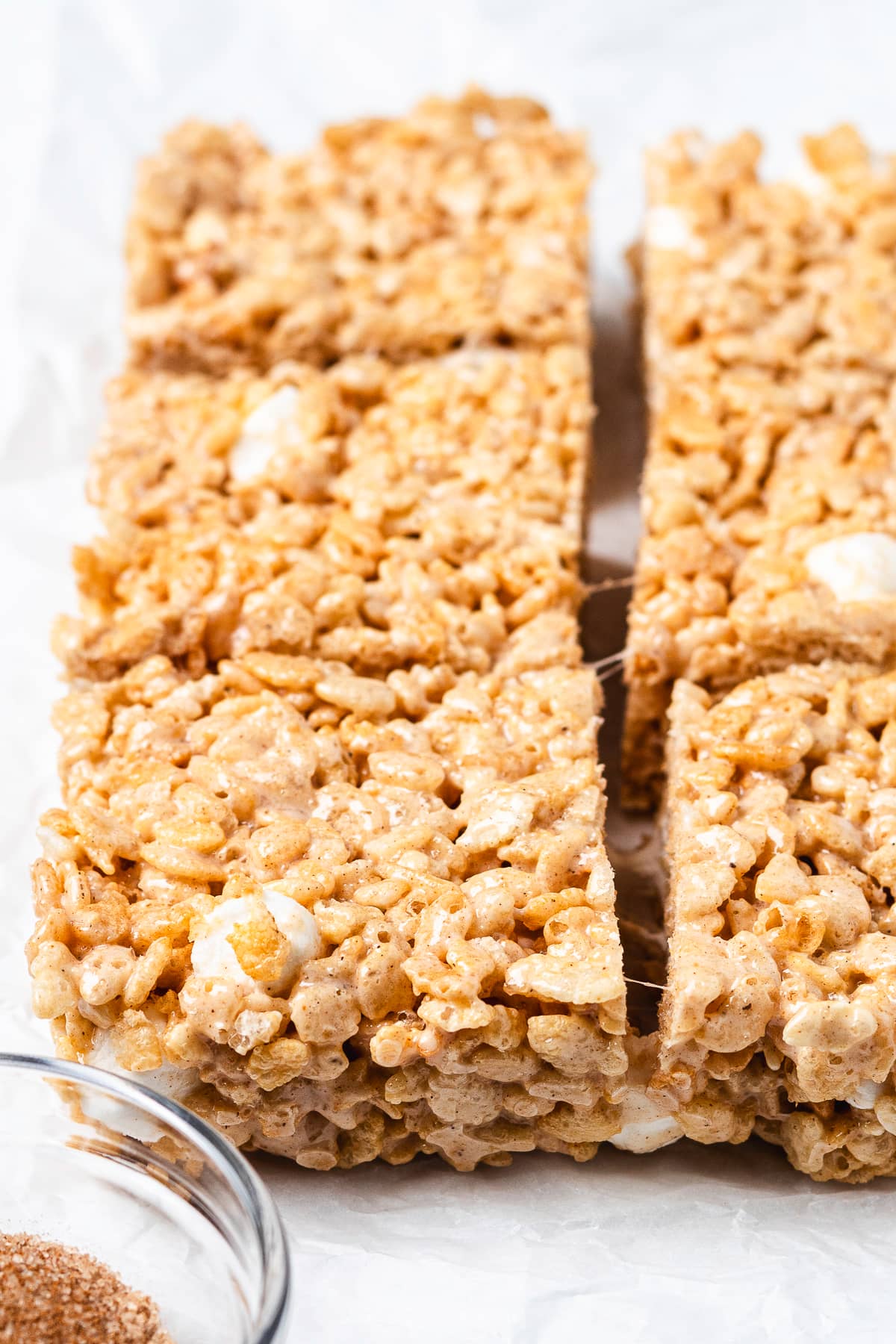 Chai Rice Krispie Treats cut into squares with marshmallow pieces.