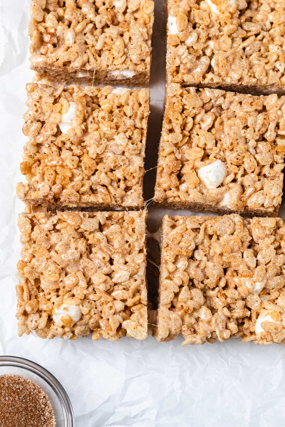 Chai Rice Krispie Treats arranged in rows with marshmallow pieces.