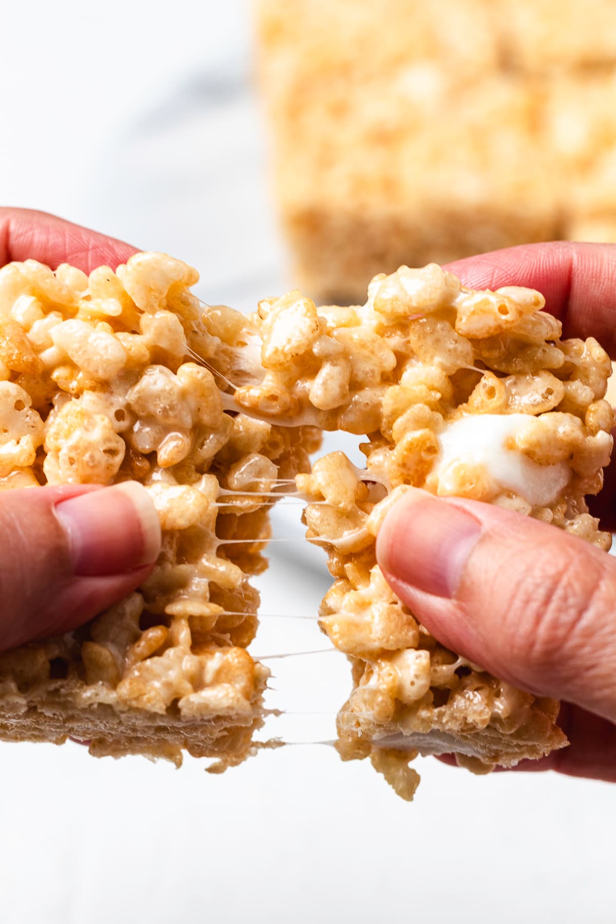 Rice Krispie Treat pulled apart with marshmallow strands.