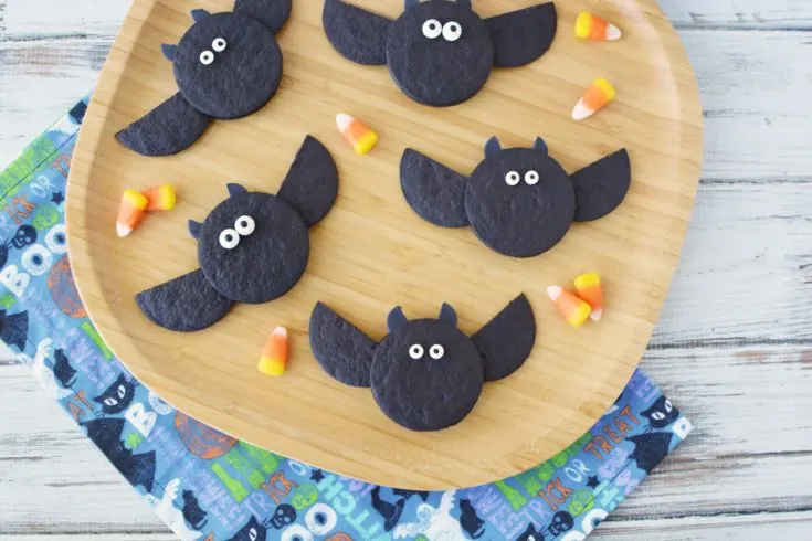 Bat cookies on a bamboo plate.