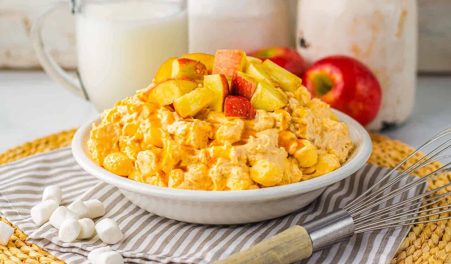 Caramel apple dessert fluff in a white bowl.