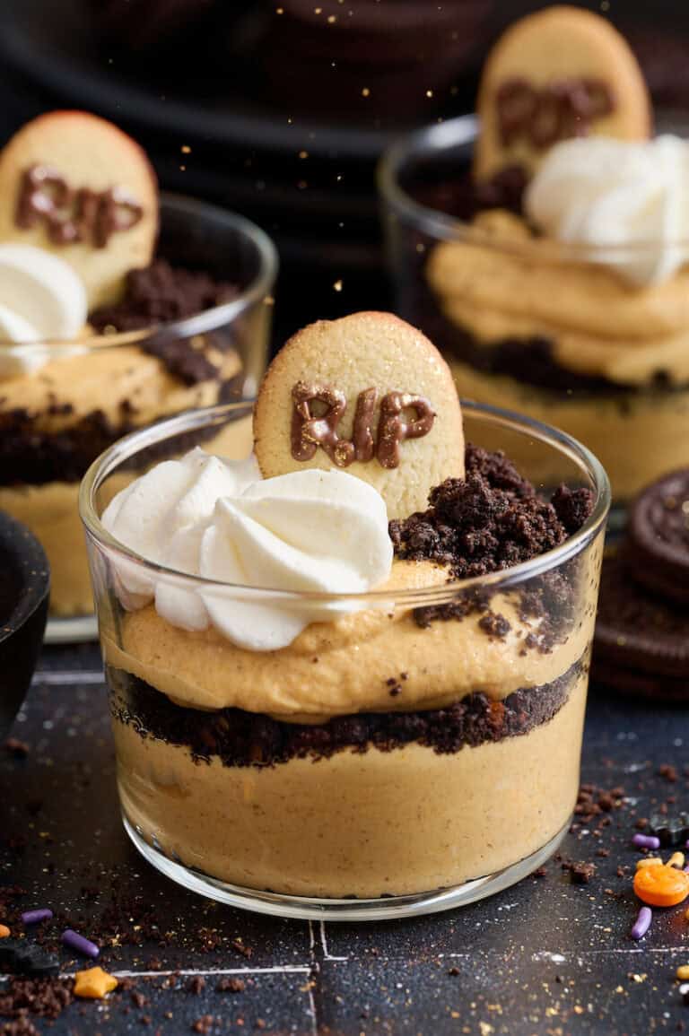 Chocolate pumpkin cheesecake parfaits in a glass.