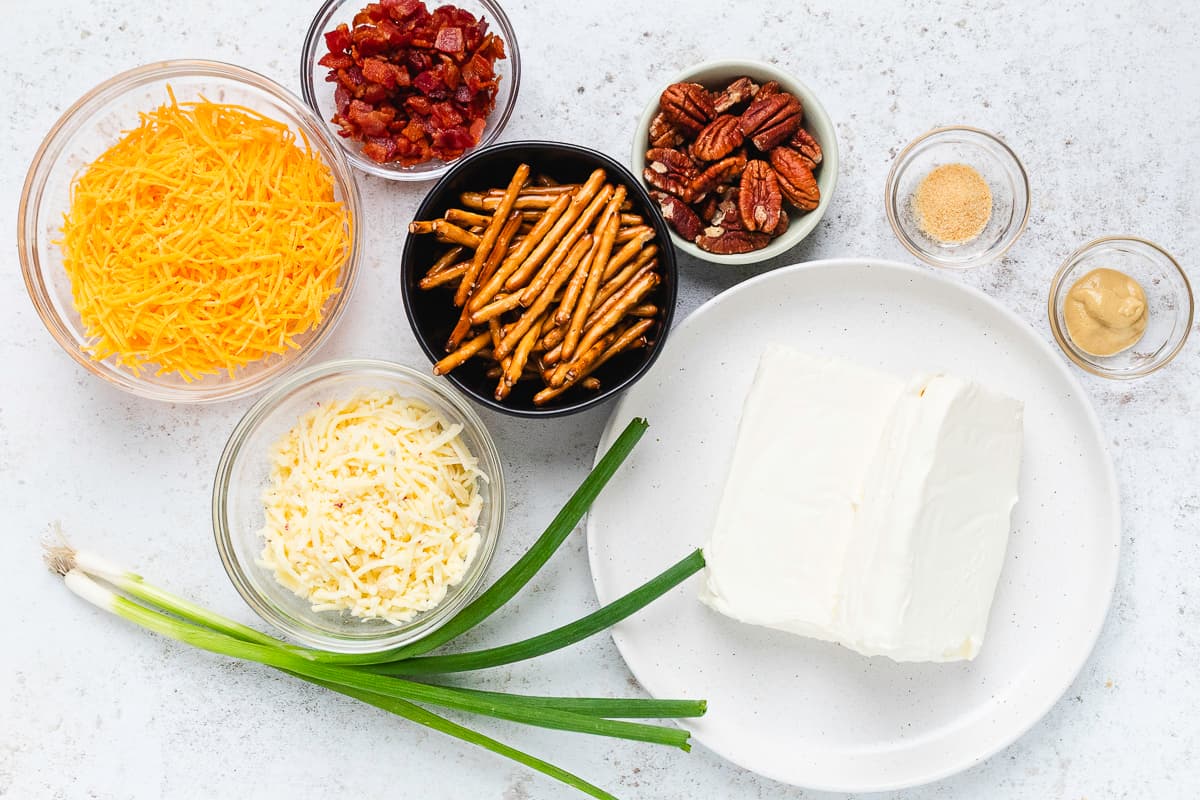 Cream cheese, shredded cheese, bacon, pecans, pretzel sticks, green onions, and seasonings for mini cheese balls.