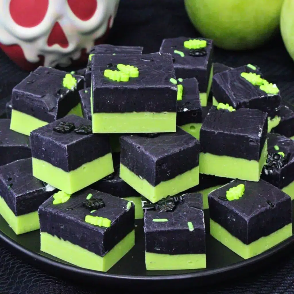 Green and black "poison apple" fudge stacked.