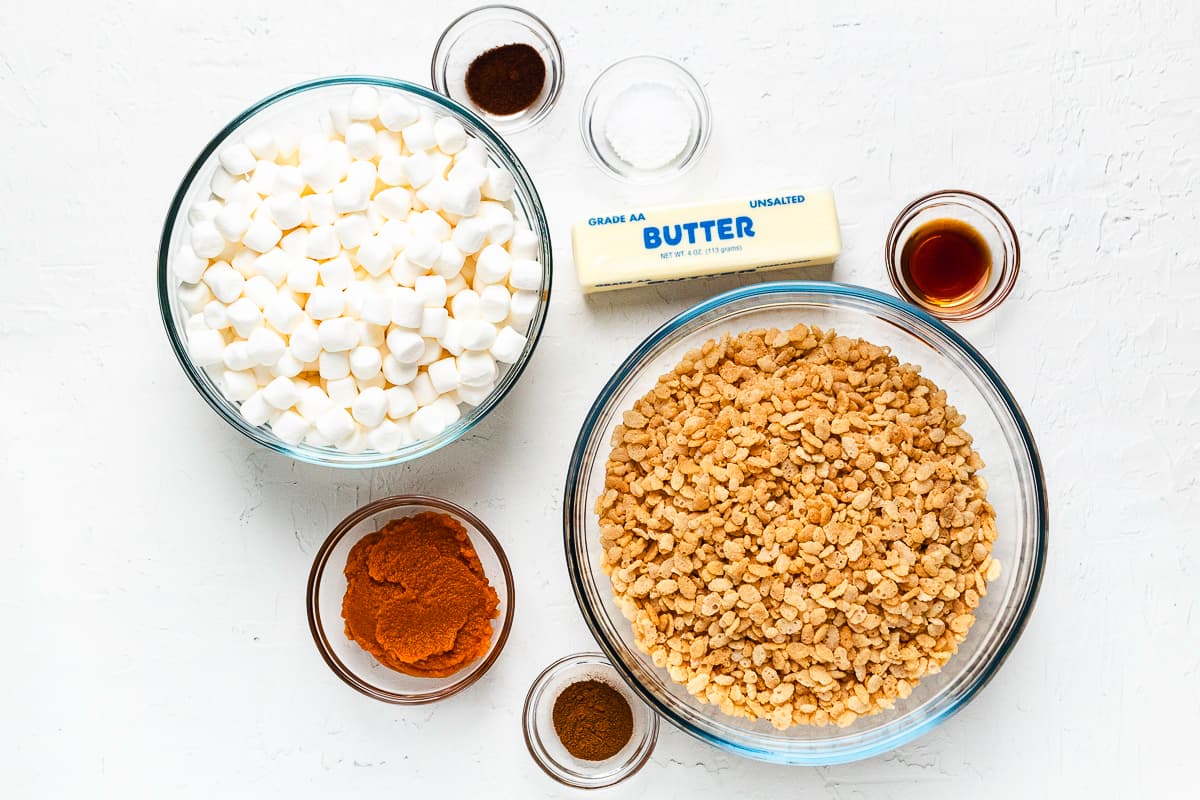 Ingredients for Pumpkin Rice Krispie Treats, including cereal, marshmallows, butter, pumpkin, and spices.